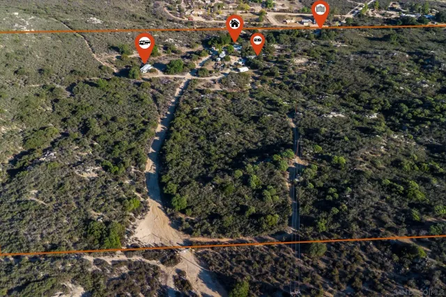 a view of a city with lush green forest