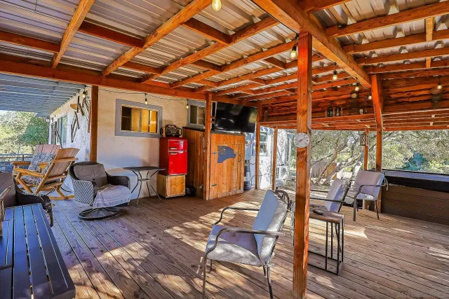 a kitchen with stainless steel appliances granite countertop a sink and a refrigerator