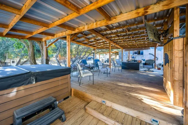 a kitchen with kitchen island stainless steel appliances a sink and cabinets
