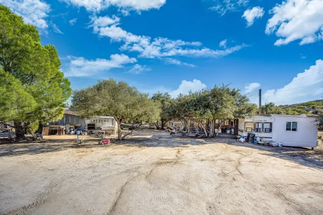 a bathroom with a sink a toilet and a shower