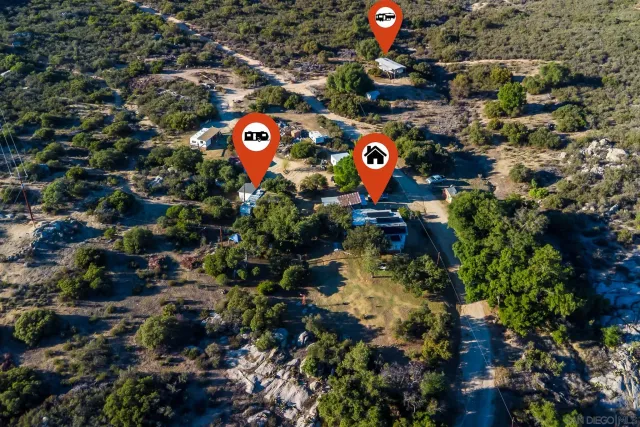 a view of a chairs and table in a backyard