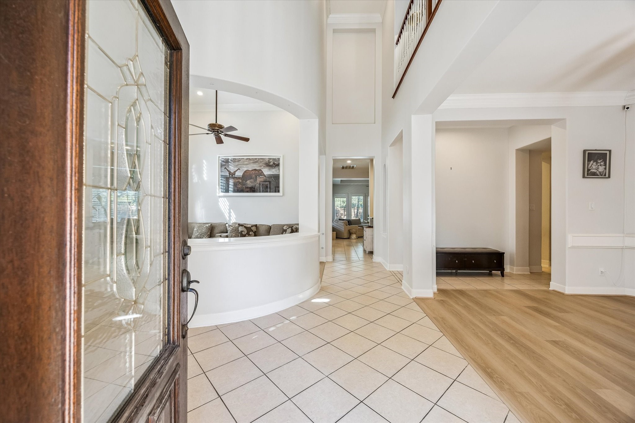 3047 Bonnebridge Way Boulevard Houston, TX 77082 - Photo 11 of 50 From the moment you step inside, you are welcomed by a warm and inviting foyer featuring soaring ceilings and a soft neutral palette. Abundant natural light fills the space, enhancing the elegance of this stunning entryway and setting the tone for the comfort and sophistication found throughout the home. Every detail reflects a perfect blend of timeless elegance and modern luxury.