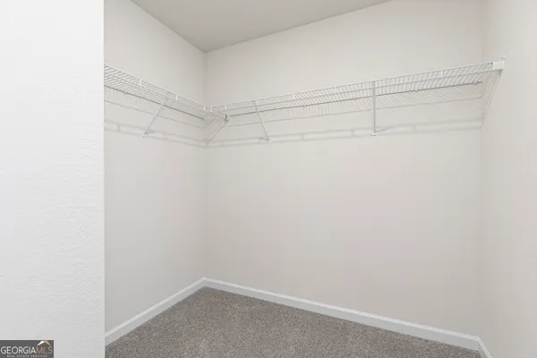 a view of a room with racks on the wall