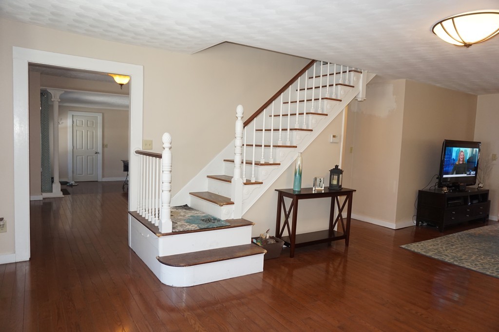 329 Mill Street Lancaster, MA 01523 - Photo 12 of 30 a view of entryway and hall with wooden floor