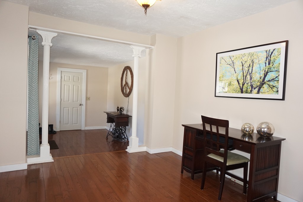 329 Mill Street Lancaster, MA 01523 - Photo 13 of 30 a view of a livingroom with furniture and a wooden floor