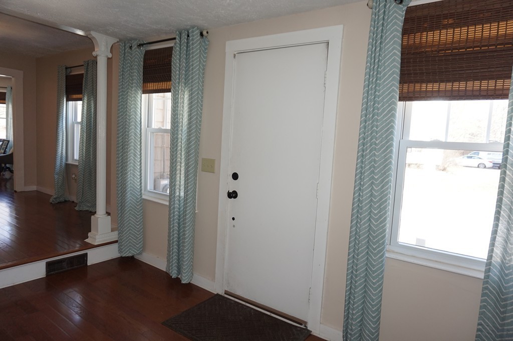 329 Mill Street Lancaster, MA 01523 - Photo 16 of 30 a view of front door with wooden floor