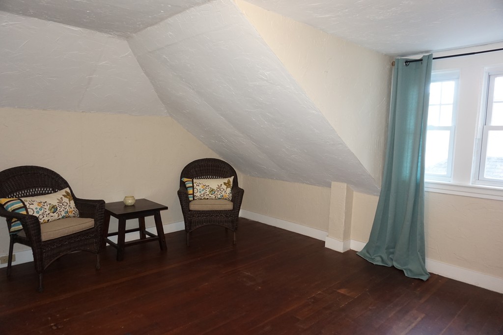 329 Mill Street Lancaster, MA 01523 - Photo 23 of 30 a view of a livingroom with furniture and hardwood floor