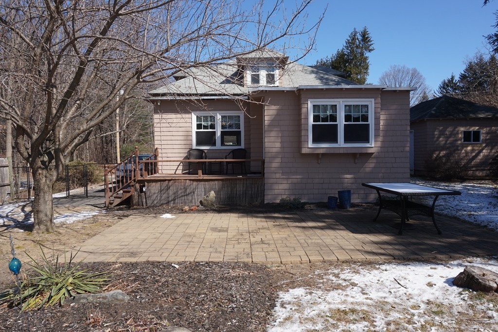 329 Mill Street Lancaster, MA 01523 - Photo 27 of 30 a view of a house with a yard covered in snow