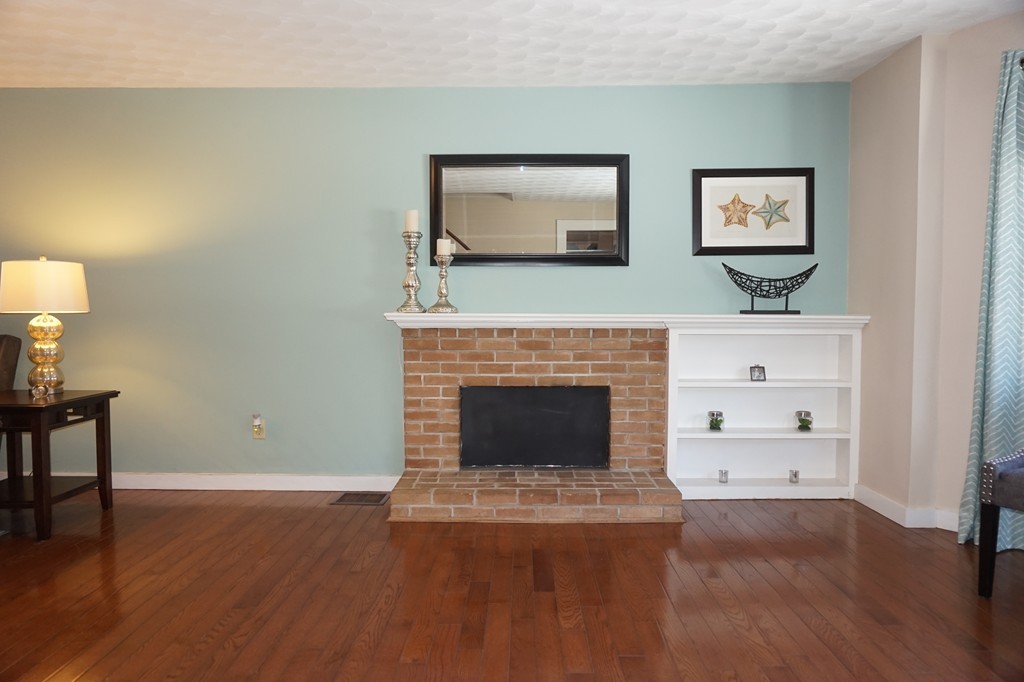 329 Mill Street Lancaster, MA 01523 - Photo 4 of 30 a living room with furniture and a fireplace