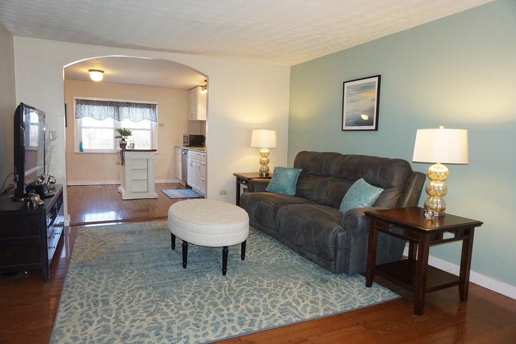 329 Mill Street Lancaster, MA 01523 - Photo 6 of 30 a living room with furniture and a rug