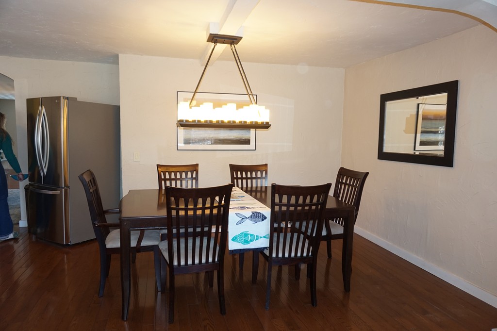 329 Mill Street Lancaster, MA 01523 - Photo 9 of 30 a view of a dining room with furniture wooden floor and chandelier