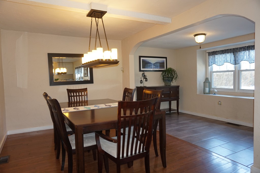 329 Mill Street Lancaster, MA 01523 - Photo 10 of 30 a view of a dining room with furniture window and wooden floor