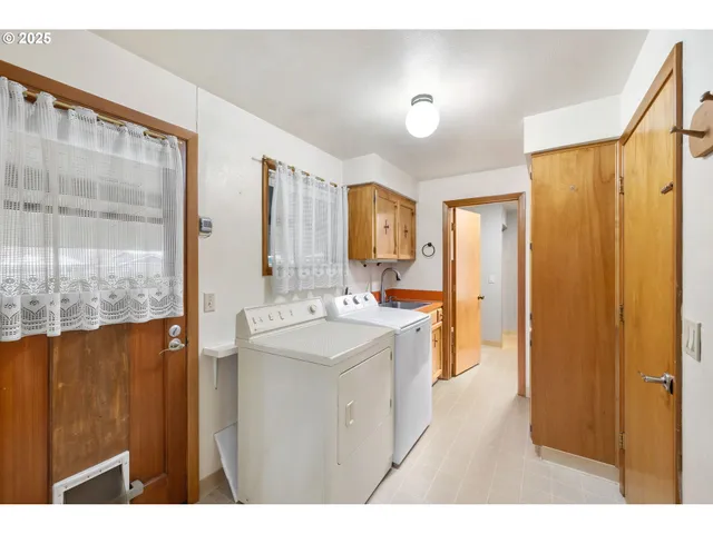 a bathroom with a sink a mirror and a shower