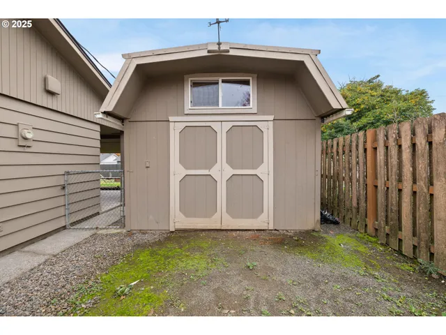 a view of an empty room with empty shelves