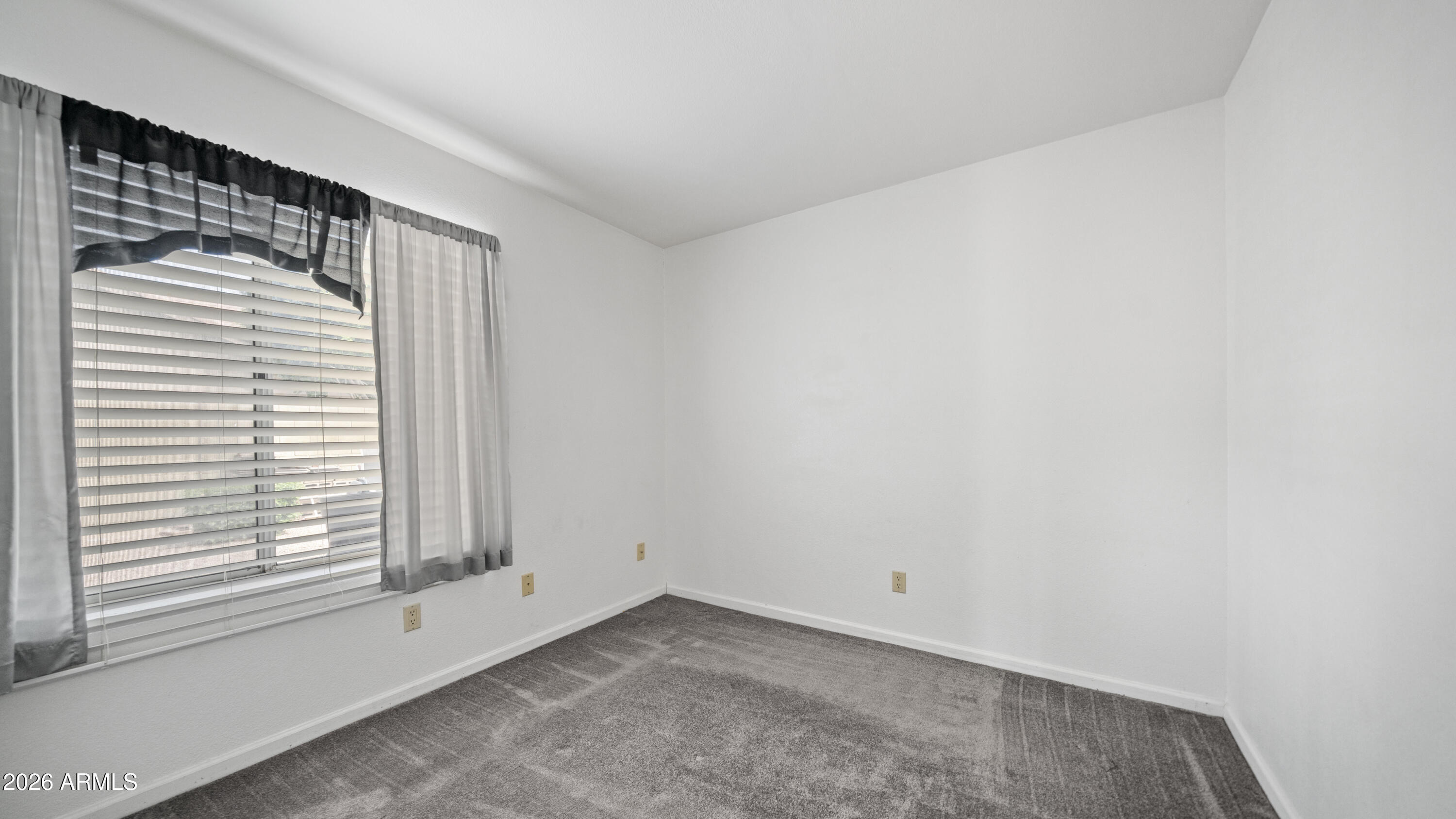 6620 West Redfield Road Glendale, AZ 85306 - Photo 24 of 33 a view of an empty room with a window