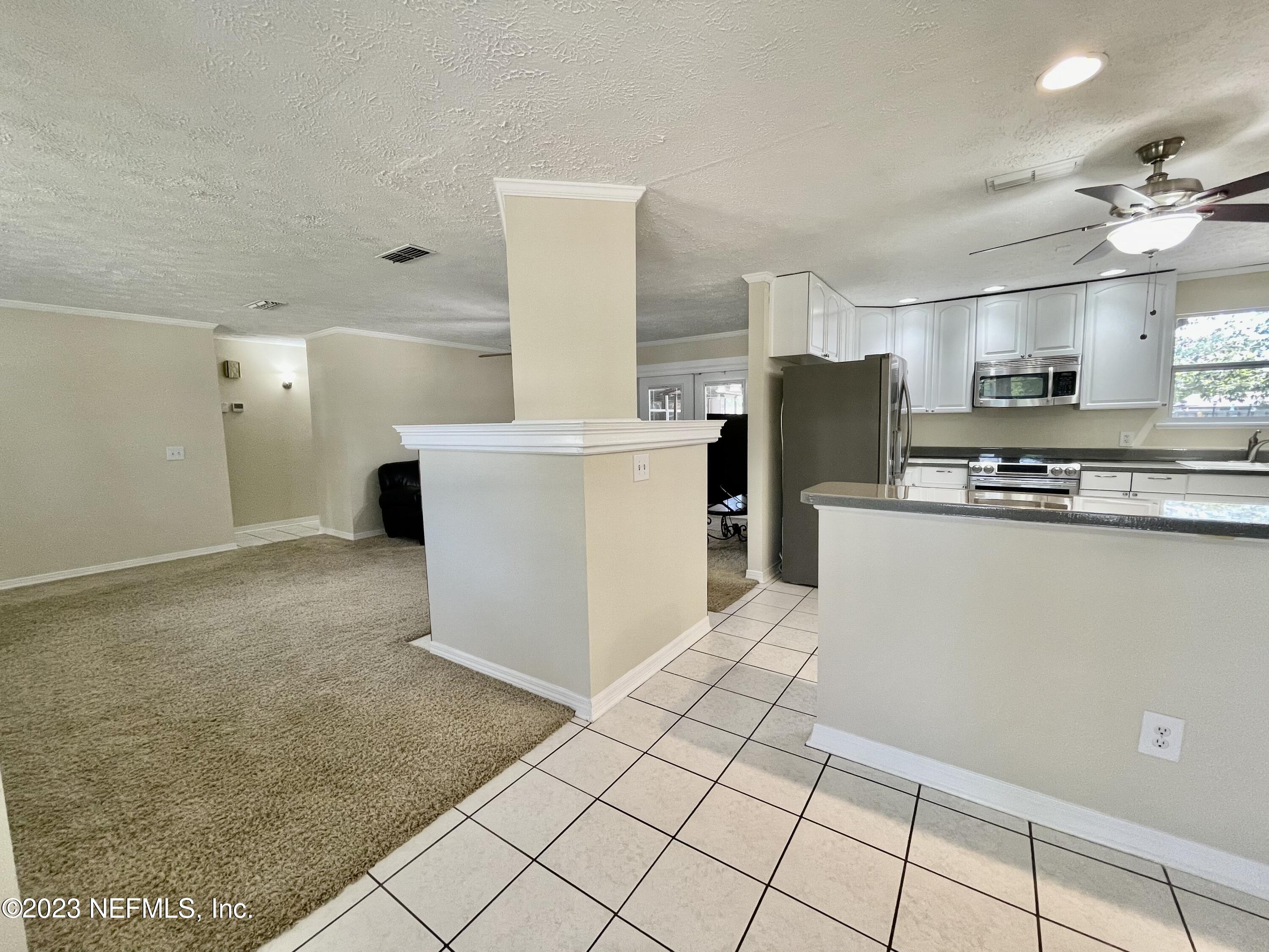 8250 Collins Road Jacksonville, FL 32244 - Photo 11 of 43 Dining to kitchen