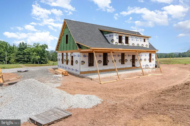 a house with large trees in front of it