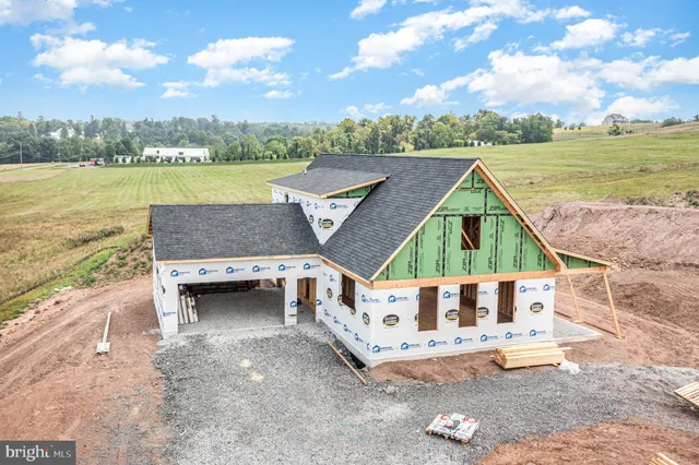an aerial view of a house with a ocean view