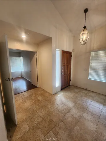 a view of empty room with a fireplace