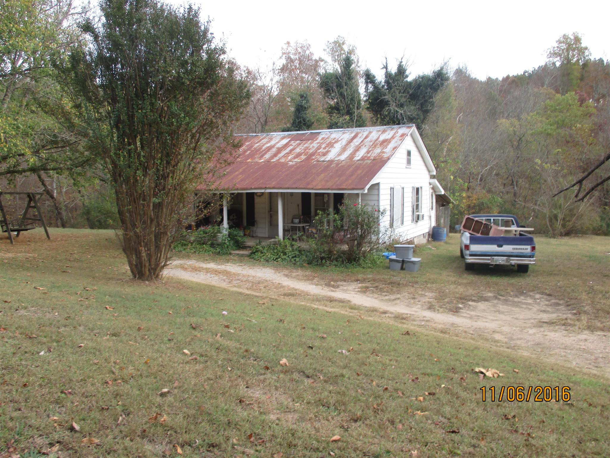 2341 Shores Road Goodspring, TN 38460 - Photo 3 of 7 a view of a house with truck parked on a road near a trees