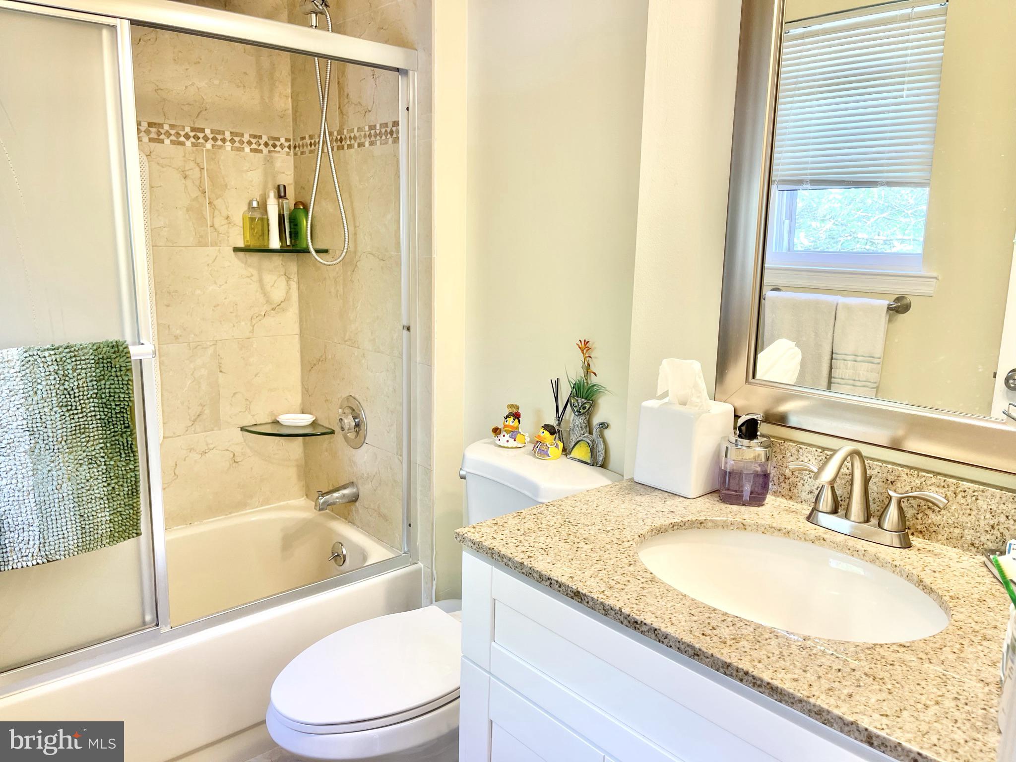 302 Marten Road Princeton, NJ 08540 - Photo 16 of 22 a bathroom with a granite countertop tub sink and mirror
