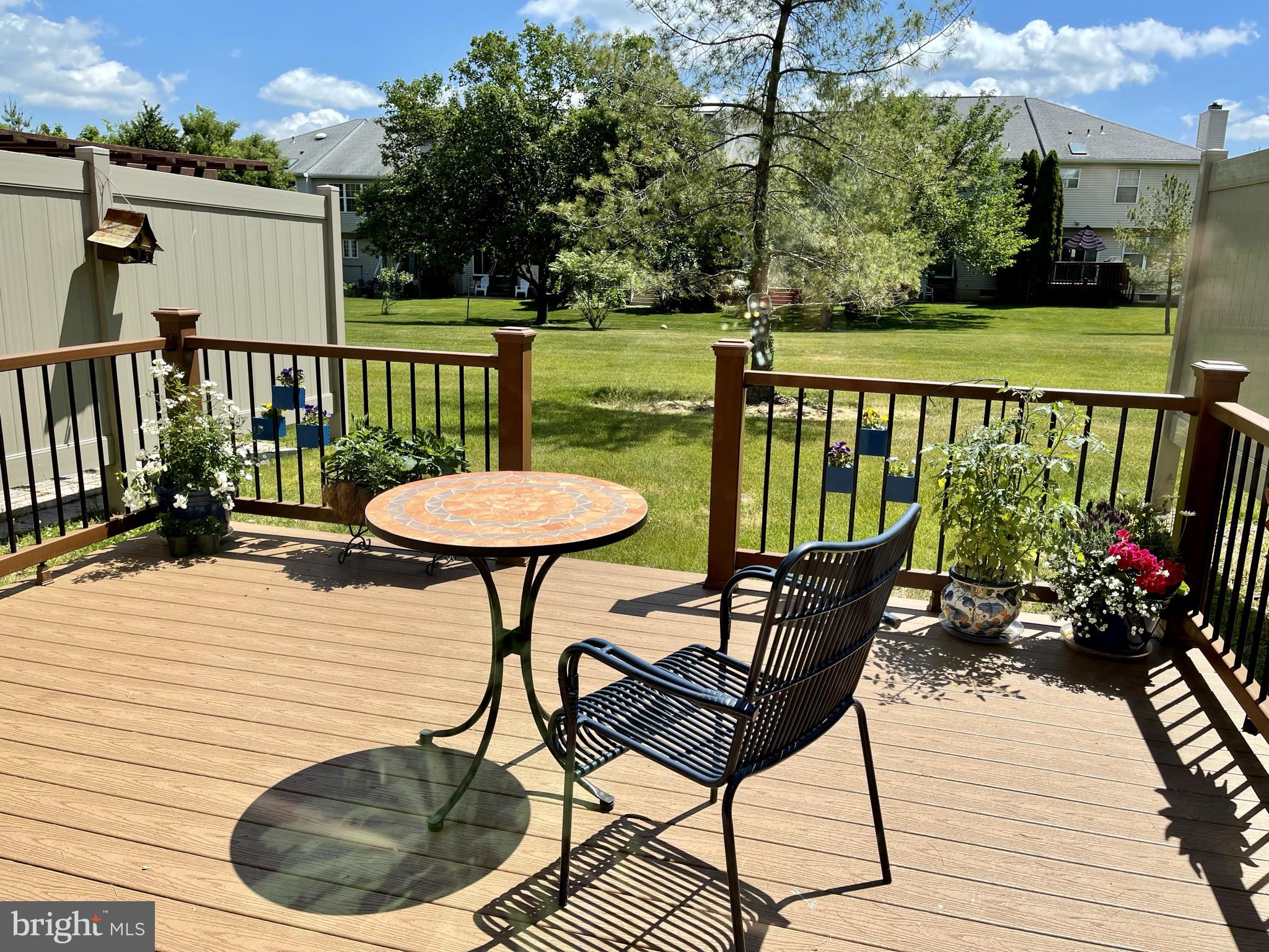 302 Marten Road Princeton, NJ 08540 - Photo 18 of 22 a balcony with wooden floor table and chairs