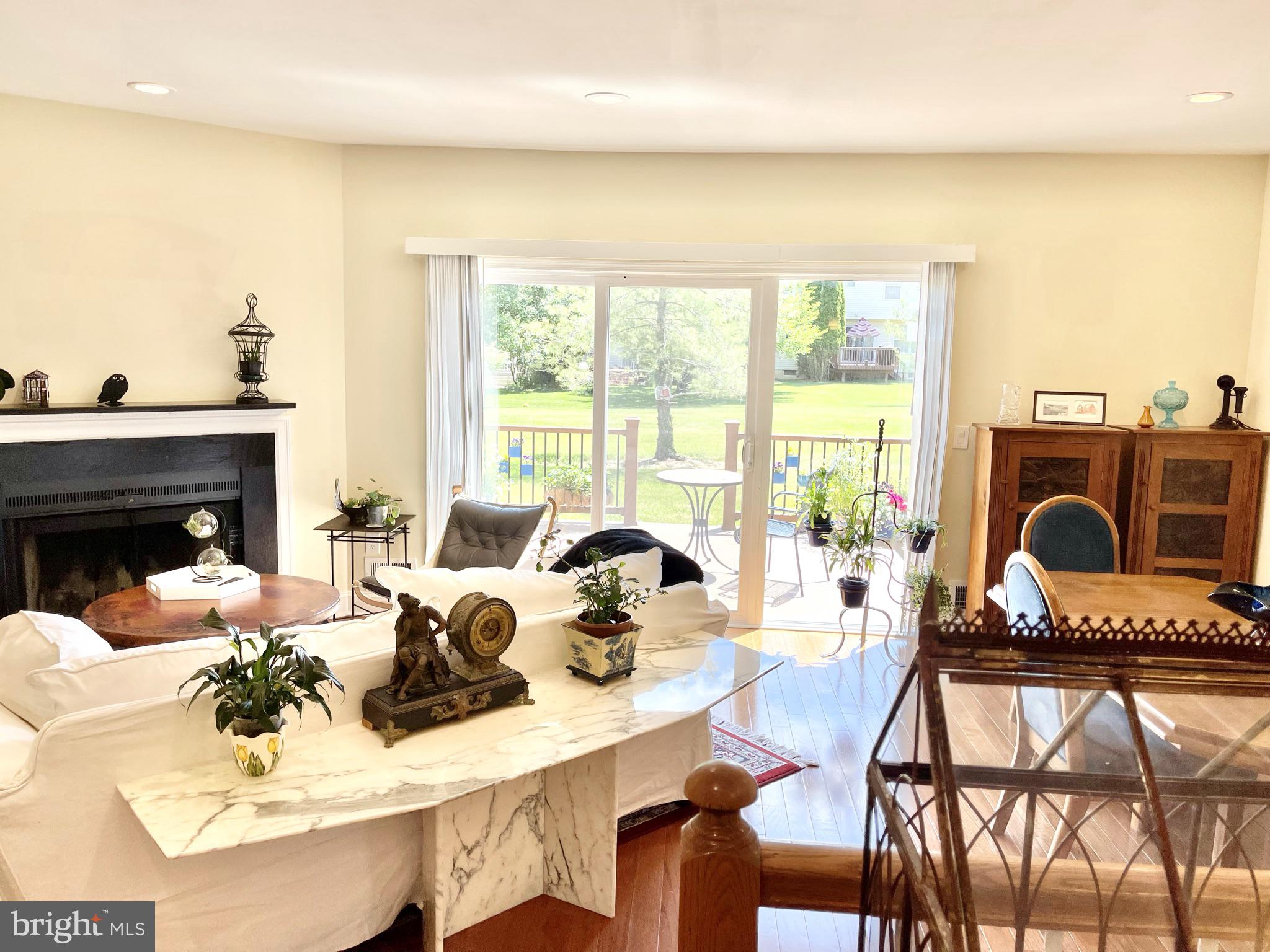302 Marten Road Princeton, NJ 08540 - Photo 4 of 22 a living room with furniture a fireplace and a table