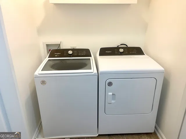 a utility room with dryer and washer