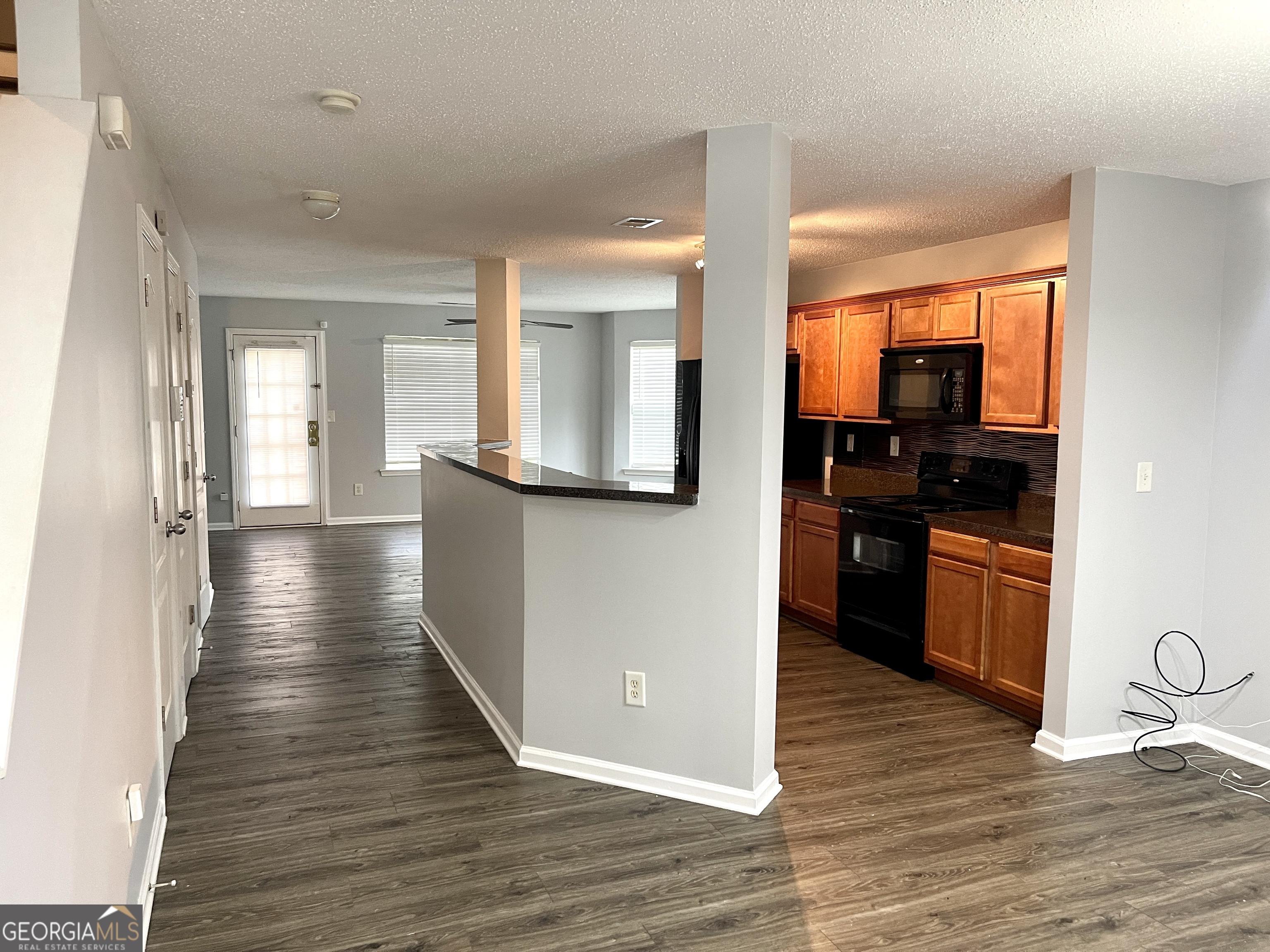 101 Prattling Court Atlanta, GA 30349 - Photo 3 of 16 a view of a kitchen with a sink and cabinets