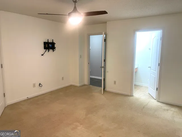 an empty room with closet area