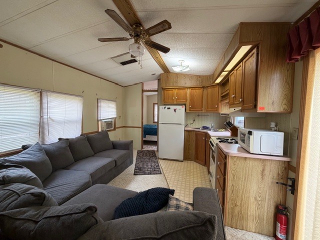 2795 East 28th Road Marseilles, IL 61341 - Photo 6 of 56 a living room with furniture and a view of kitchen