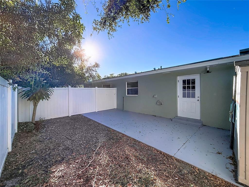 650 Athens Street Dunedin, FL 34698 - Photo 31 of 39 front view of a house with a yard