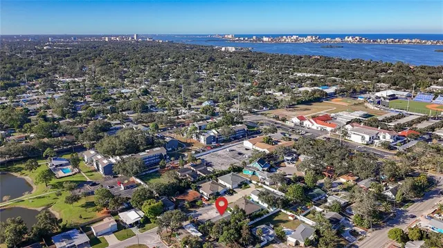 an aerial view of multiple houses with street