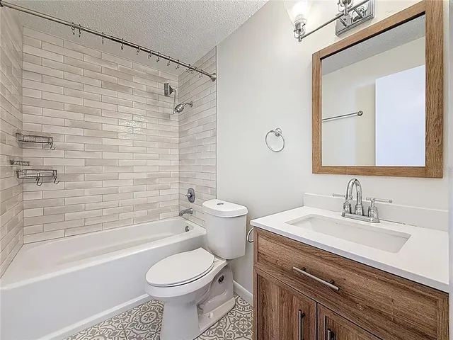 a bathroom with a sink a toilet and a bathtub