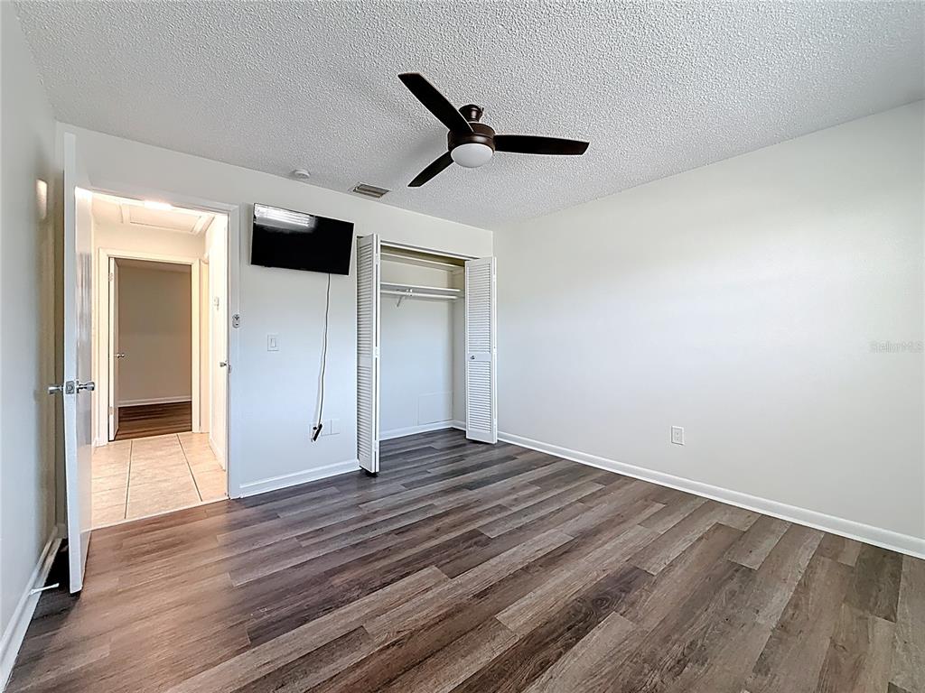 650 Athens Street Dunedin, FL 34698 - Photo 6 of 39 a view of empty room with wooden floor
