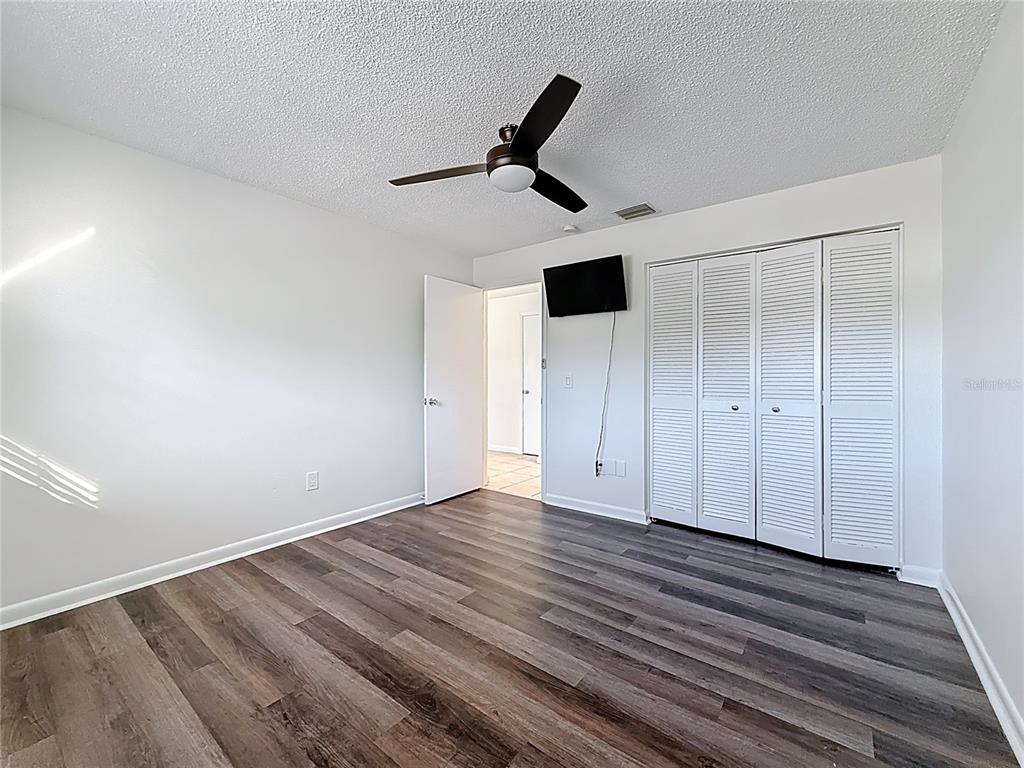 650 Athens Street Dunedin, FL 34698 - Photo 7 of 39 a view of empty room with wooden floor