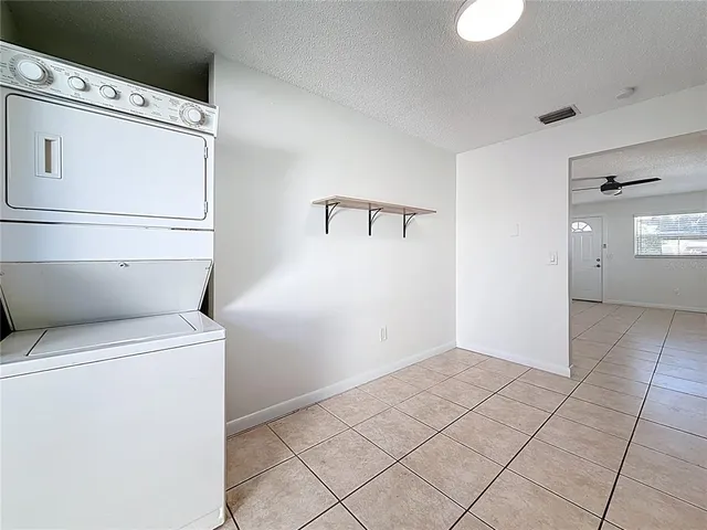 a view of storage and utility room with washer and dryer