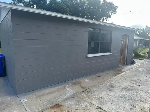 a view of a backyard of the house