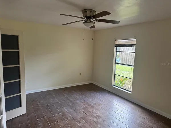 a living room with furniture and a window