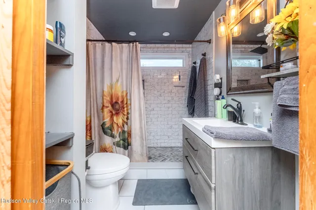 a bedroom with furniture and a wooden floor