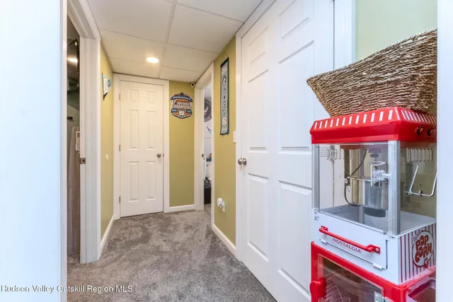 a view of a livingroom with furniture and a dining table