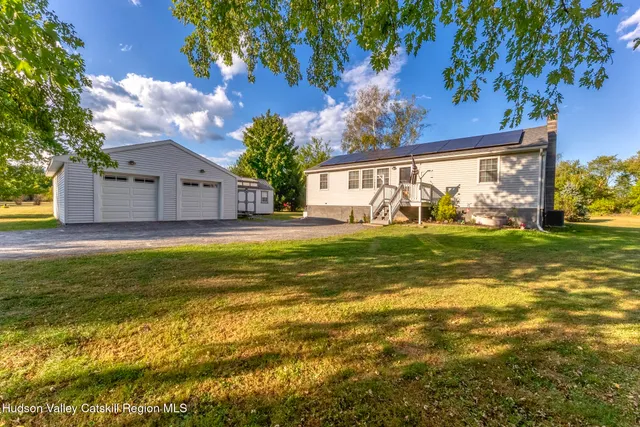 a view of a house with a big yard