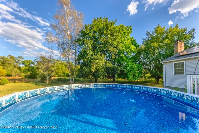 a view of a swimming pool with a patio