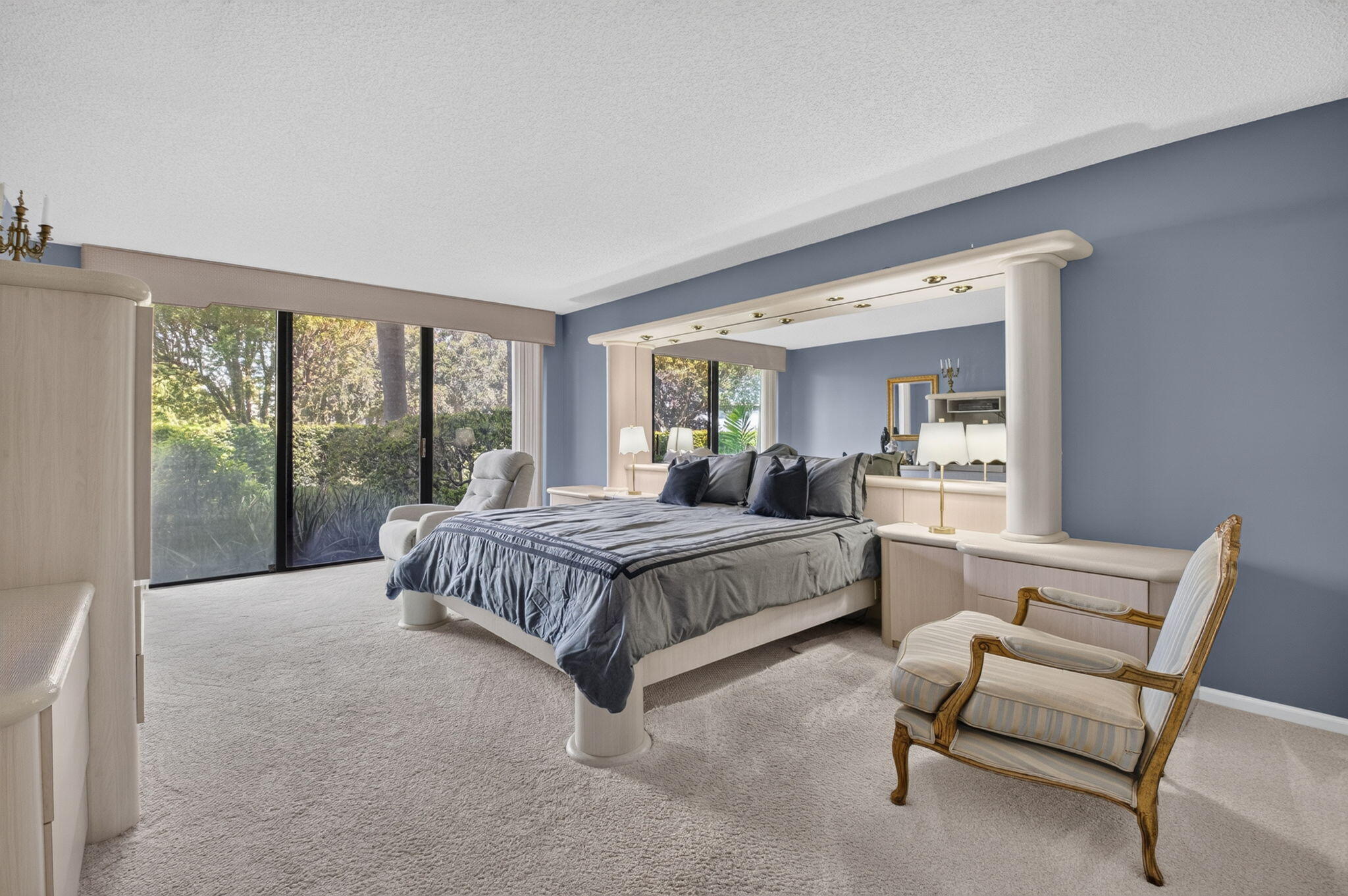 1401 South Ocean Boulevard, Unit 1060 Boca Raton, FL 33432 - Photo 16 of 46 a spacious bedroom with a bed and glass window