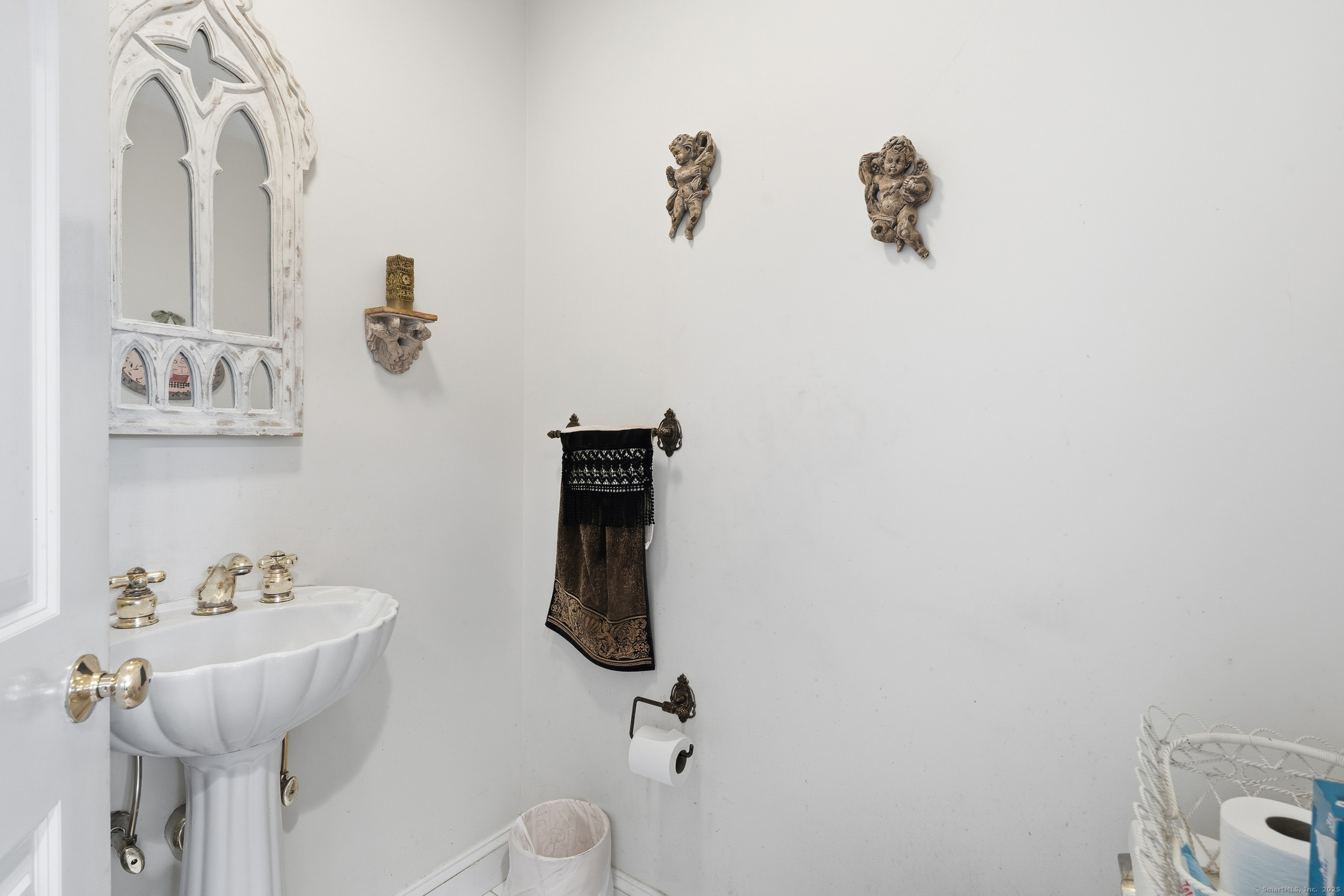 59 Prospect Street, Unit C Ridgefield, CT 06877 - Photo 14 of 38 a bathroom with a sink and mirror