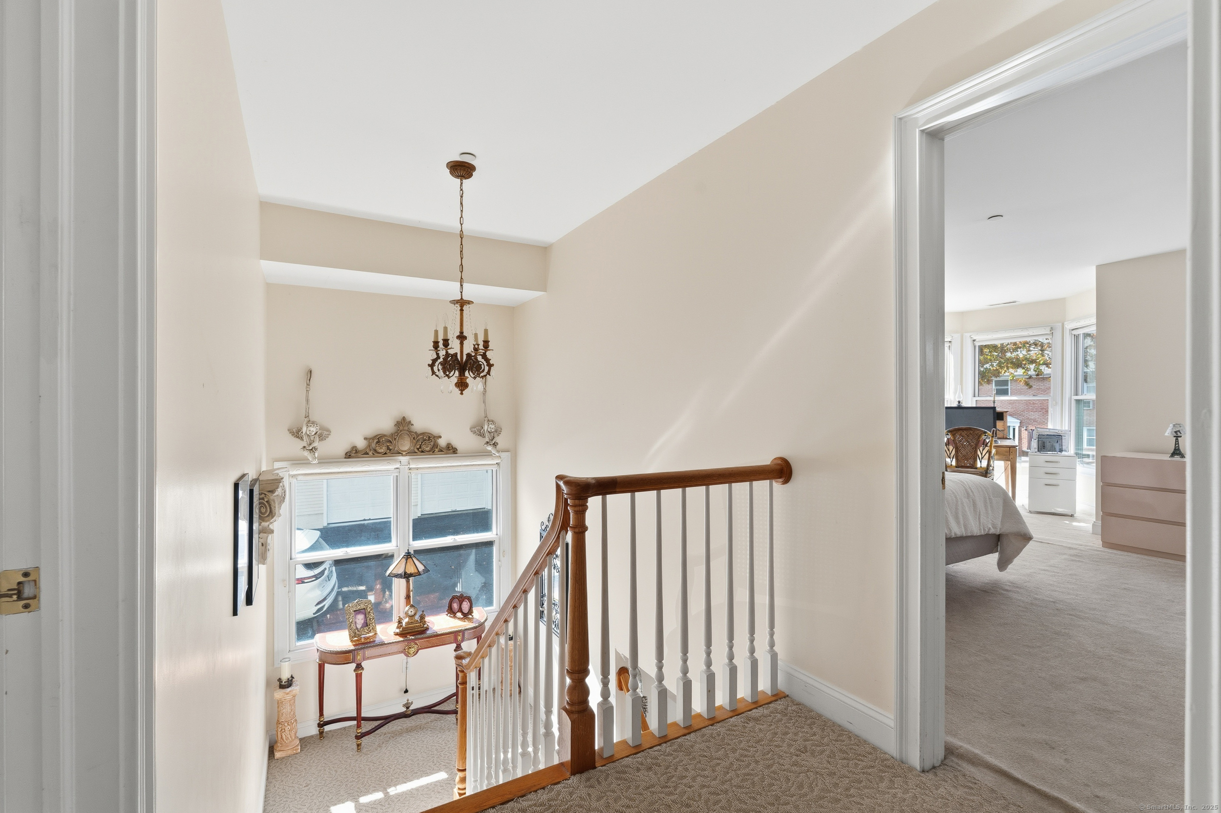 59 Prospect Street, Unit C Ridgefield, CT 06877 - Photo 17 of 38 a view of a hallway with dining room and stairs
