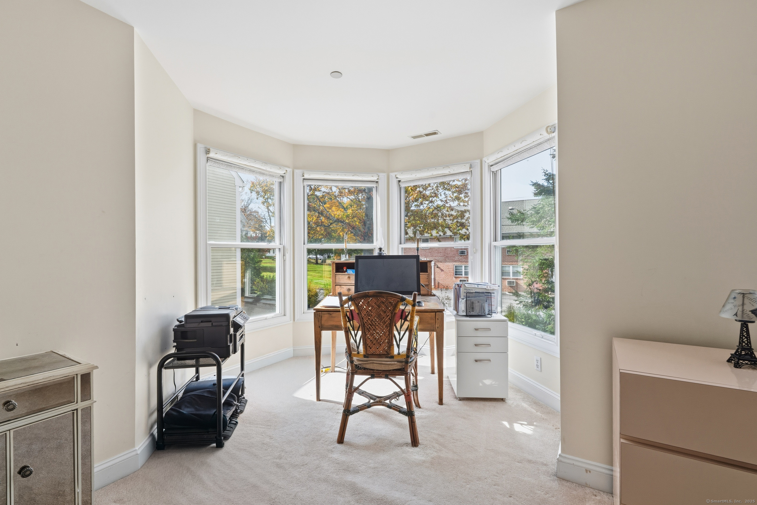 59 Prospect Street, Unit C Ridgefield, CT 06877 - Photo 19 of 38 a workspace with furniture and a window