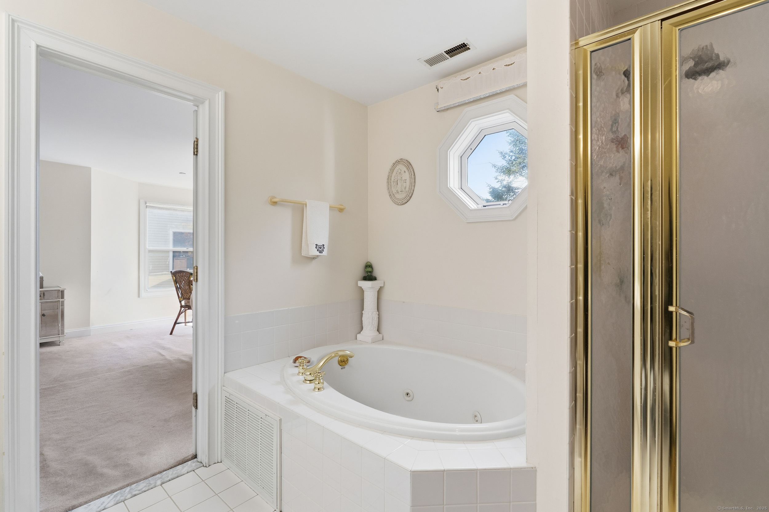 59 Prospect Street, Unit C Ridgefield, CT 06877 - Photo 20 of 38 a bathroom with a bathtub and a shower