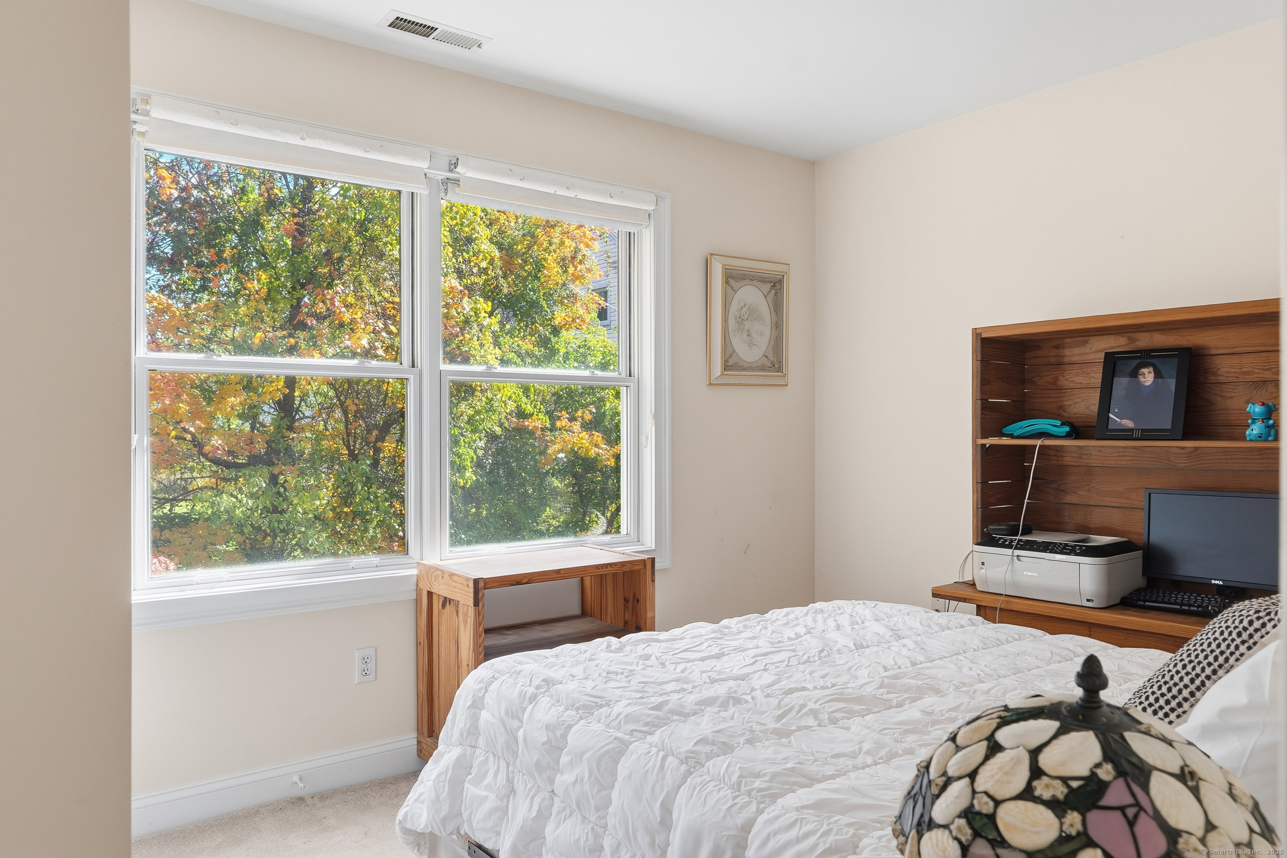 59 Prospect Street, Unit C Ridgefield, CT 06877 - Photo 29 of 38 a bedroom with a bed and a large window