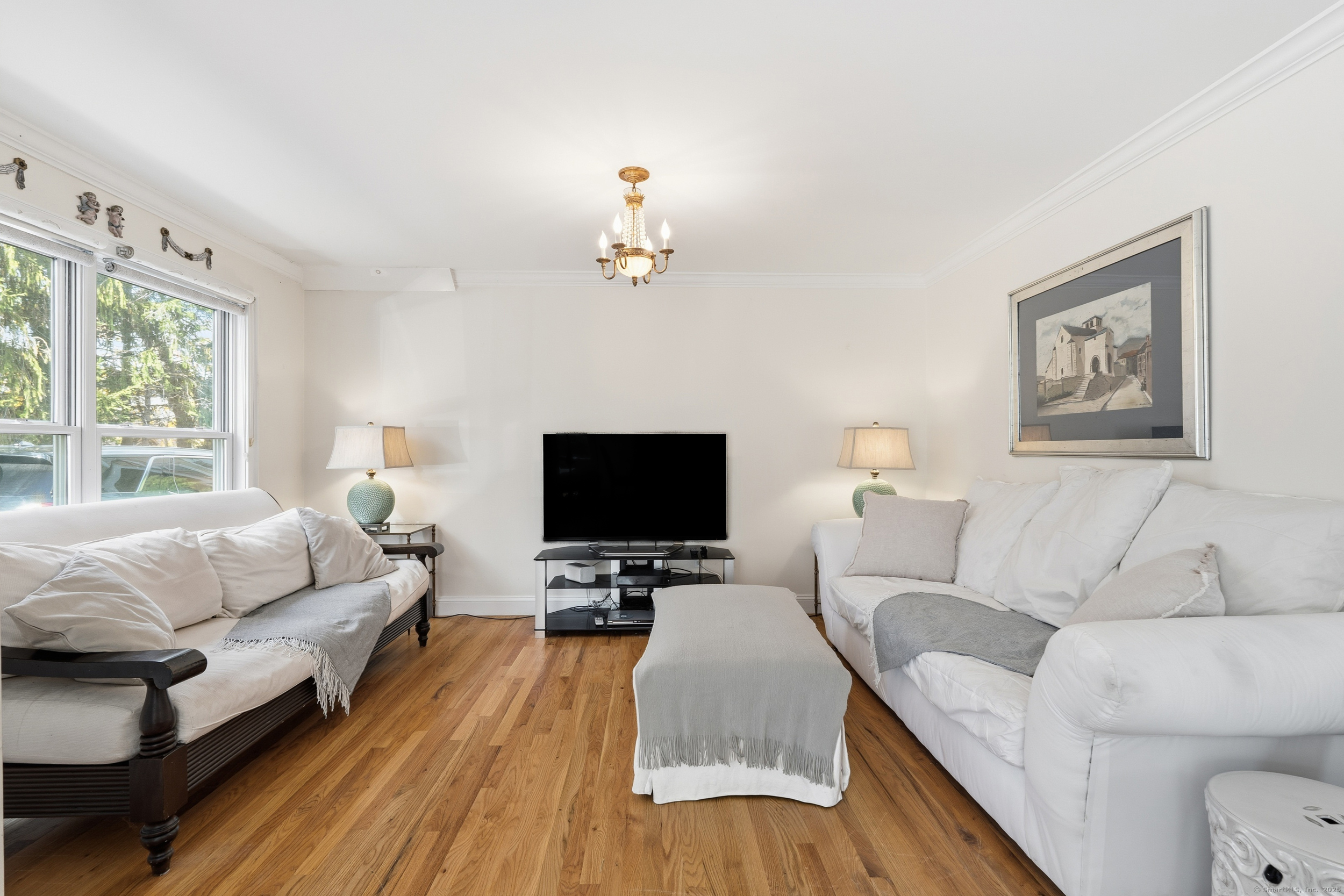 59 Prospect Street, Unit C Ridgefield, CT 06877 - Photo 5 of 38 a living room with furniture and a flat screen tv